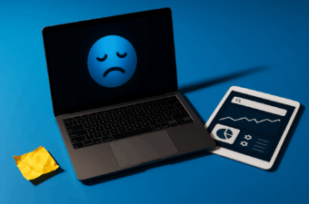 Laptop e tablet com ícone de tristeza