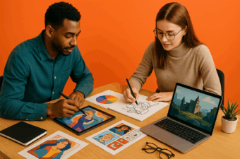 duas pessoas desenhando em mesa com arte e laptop